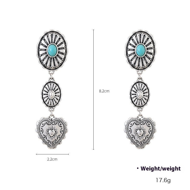 Pair of silver earrings with turquoise stones and heart designs, shown with measurements on a white background.